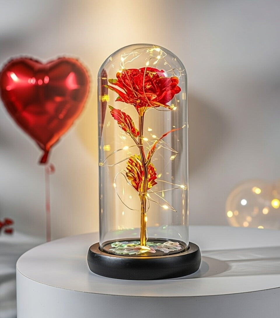 Pozłacana czerwona róża pod kloszem z podświetleniem LED